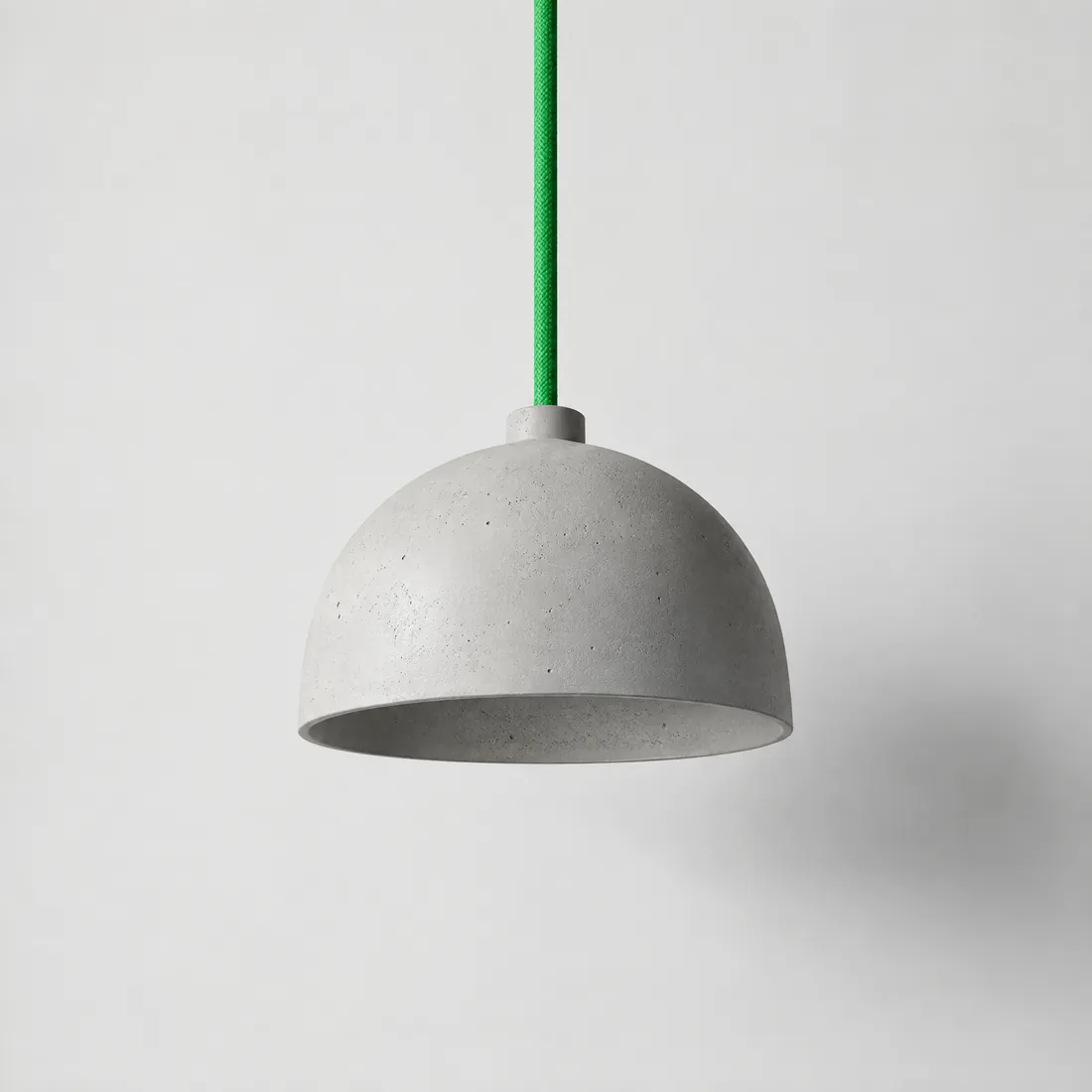 Pendant lamp in pale cast concrete